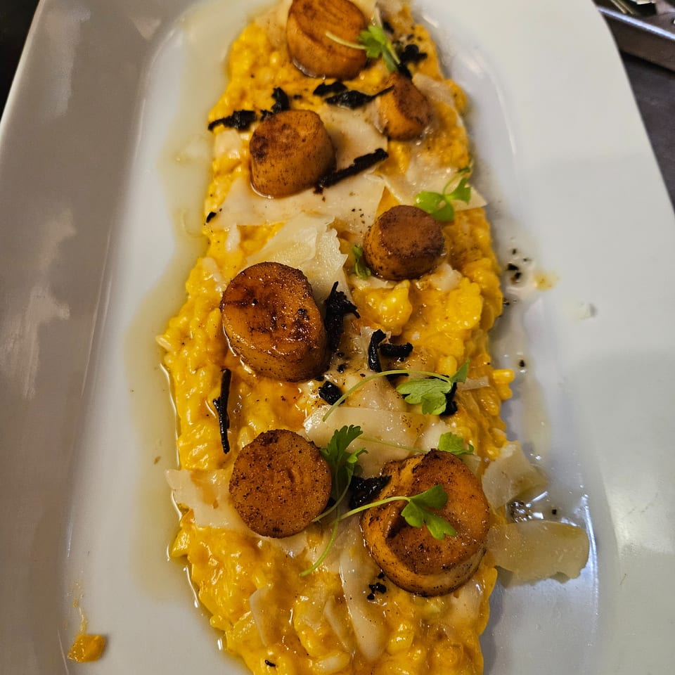 A gourmet dish of Nirvana by Chef Lindsay's butternut squash risotto with seared scallops and shaved parmesan.