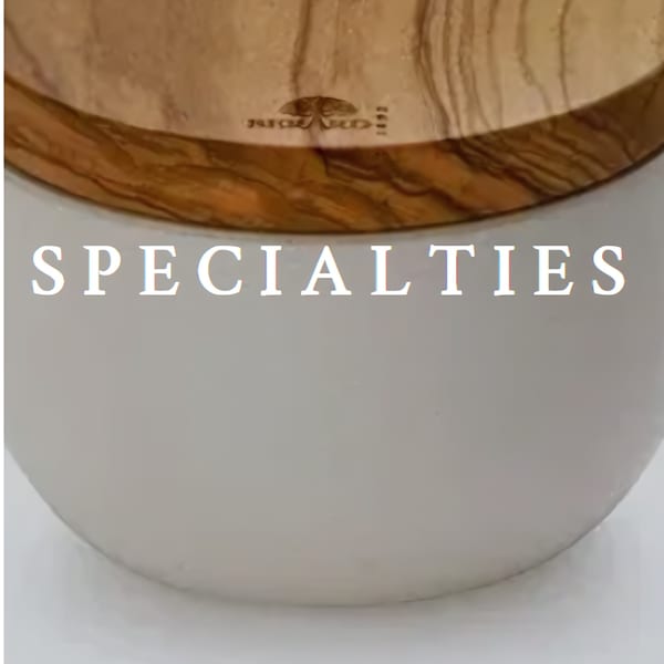 White bowl with a wooden lid, featuring the word "SPECIALTIES" in white text.