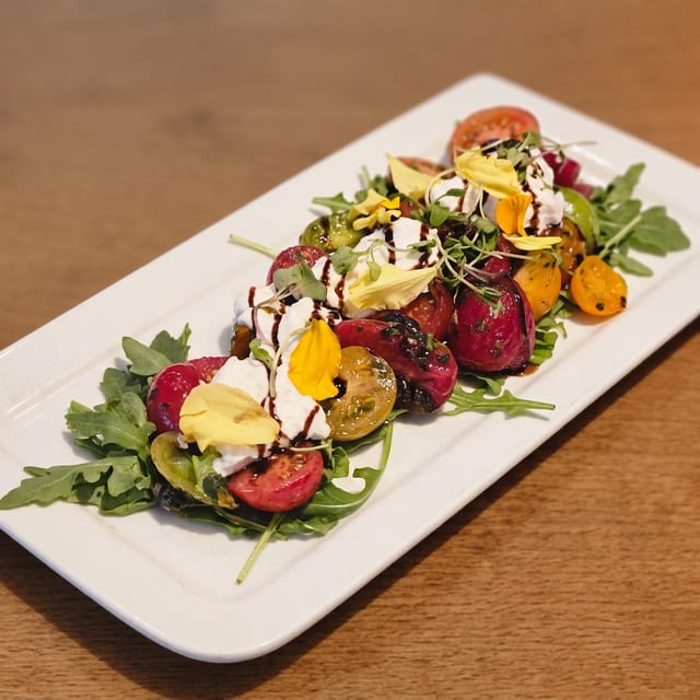 Burrata & Organic Heirloom Tomatoes*.